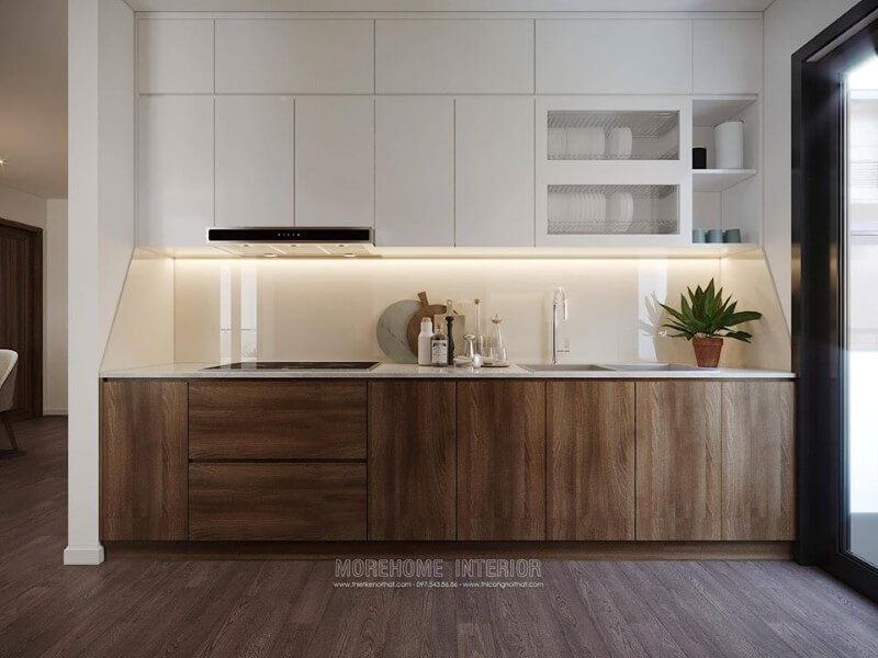 Tủ bếp dưới được làm từ gỗ công nghiệp, màu nâu trầm sang trọng, ngăn tủ cỡ lớn tạo sự thuận tiện cho việc cất, chứa đồ đạc của người nội trợ.